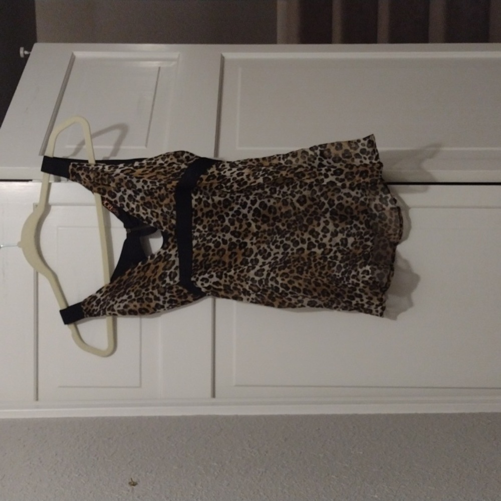 NWT sheer leopard top with criss cross black straps in back